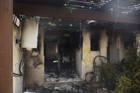 A burnt-out house after an attack by Palestinian militants on a kibbutz in Kfar Aza, Israel, near the border with Gaza.